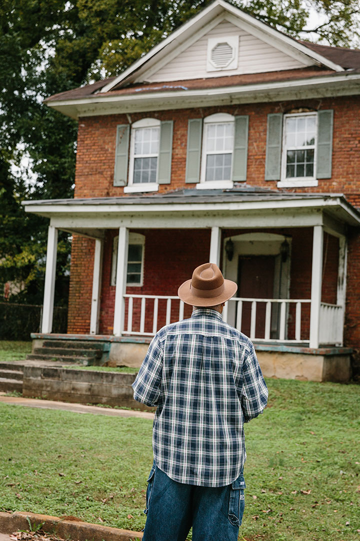 A man looks at a home in Old Town Decatur